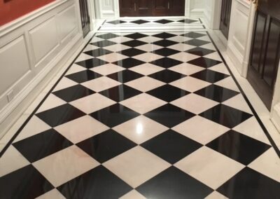 A black and white checkered floor in a hallway
