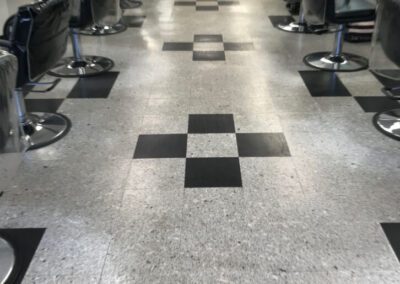 A checkered floor in a hair salon