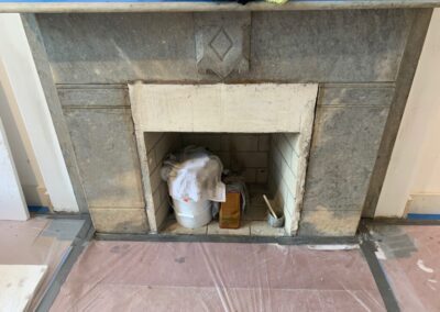 A fireplace with a bunch of items on top of it