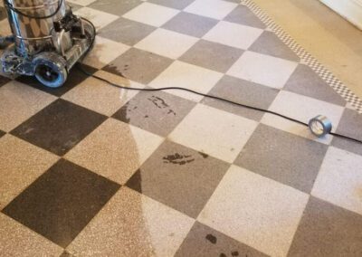 A black and white checkered floor with a vacuum on it