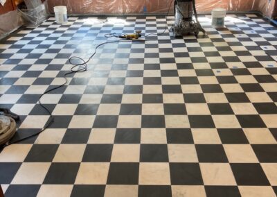 A black and white checkered floor in a large room
