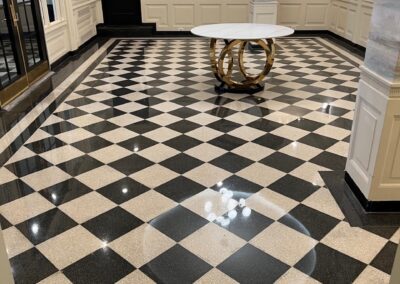 A black and white checkered floor with a table in the middle